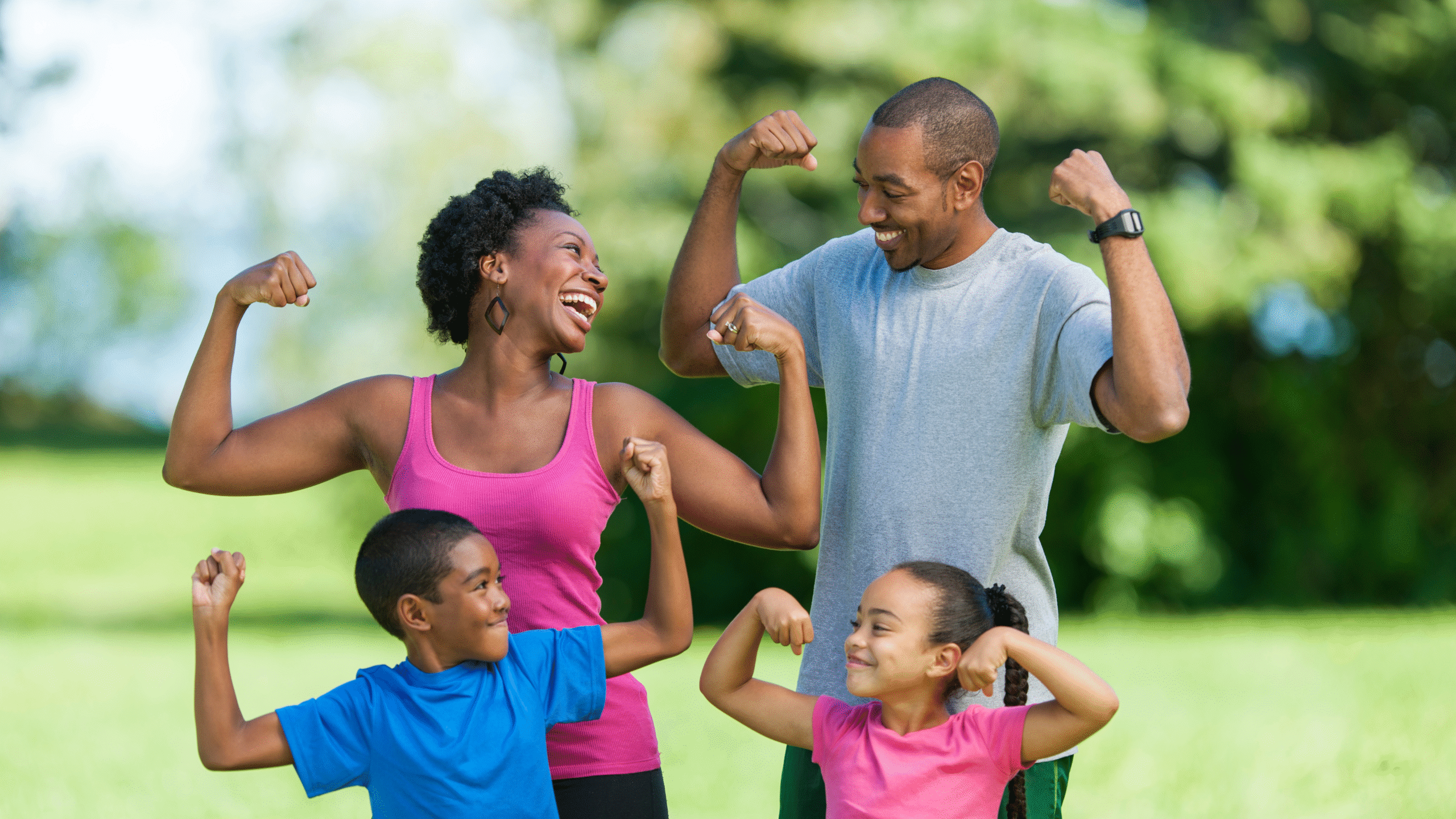 family after a workout flexing muscles