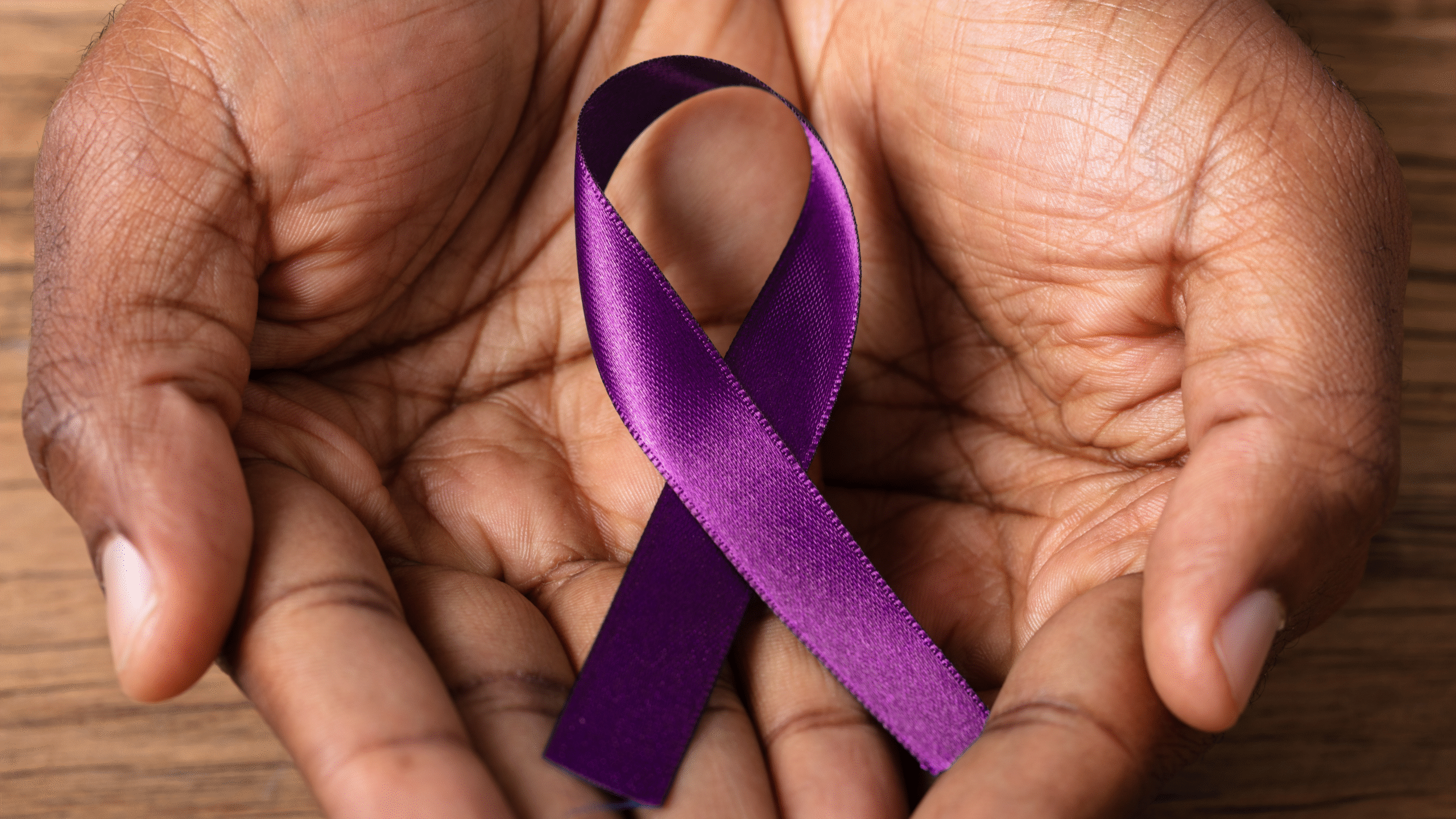 World Alzheimer's Month purple ribbon in hand
