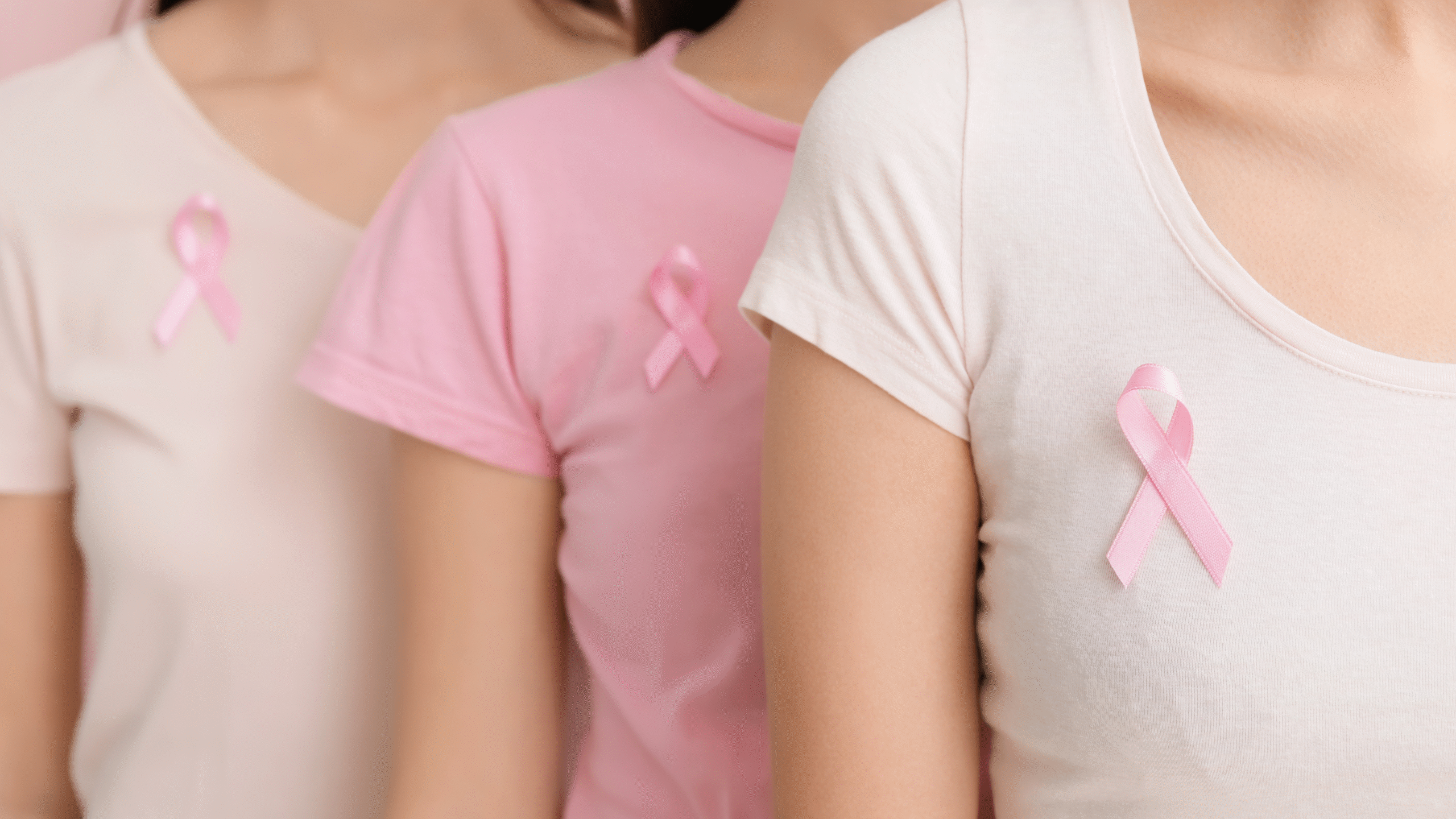 ladies with pink breast cancer ribbons