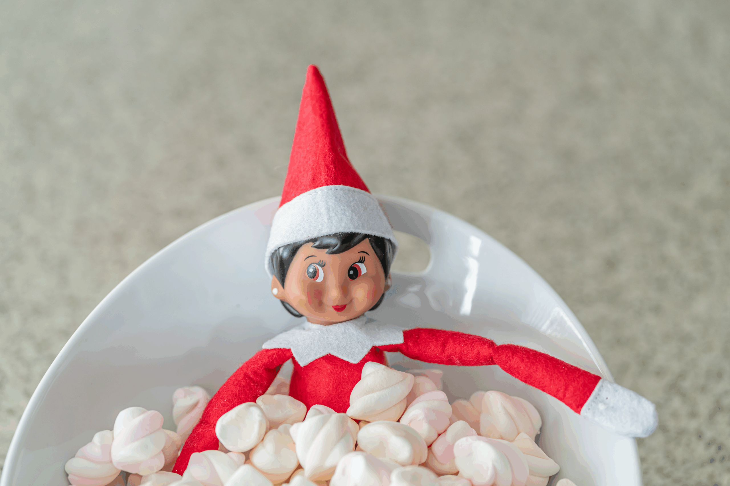 Elf on the Shelf in a bowl of marshmallows