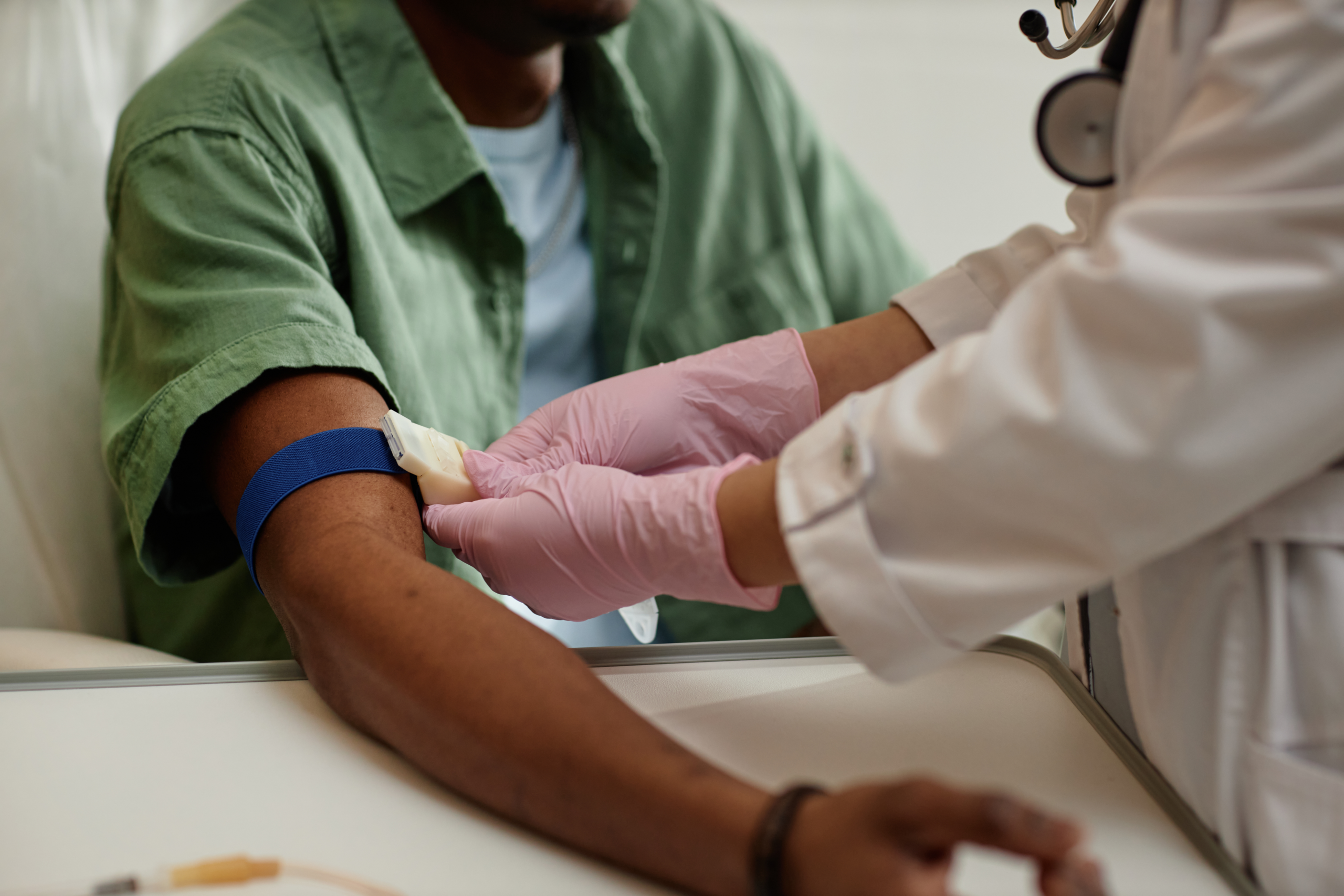 man getting blood drawn in hospital