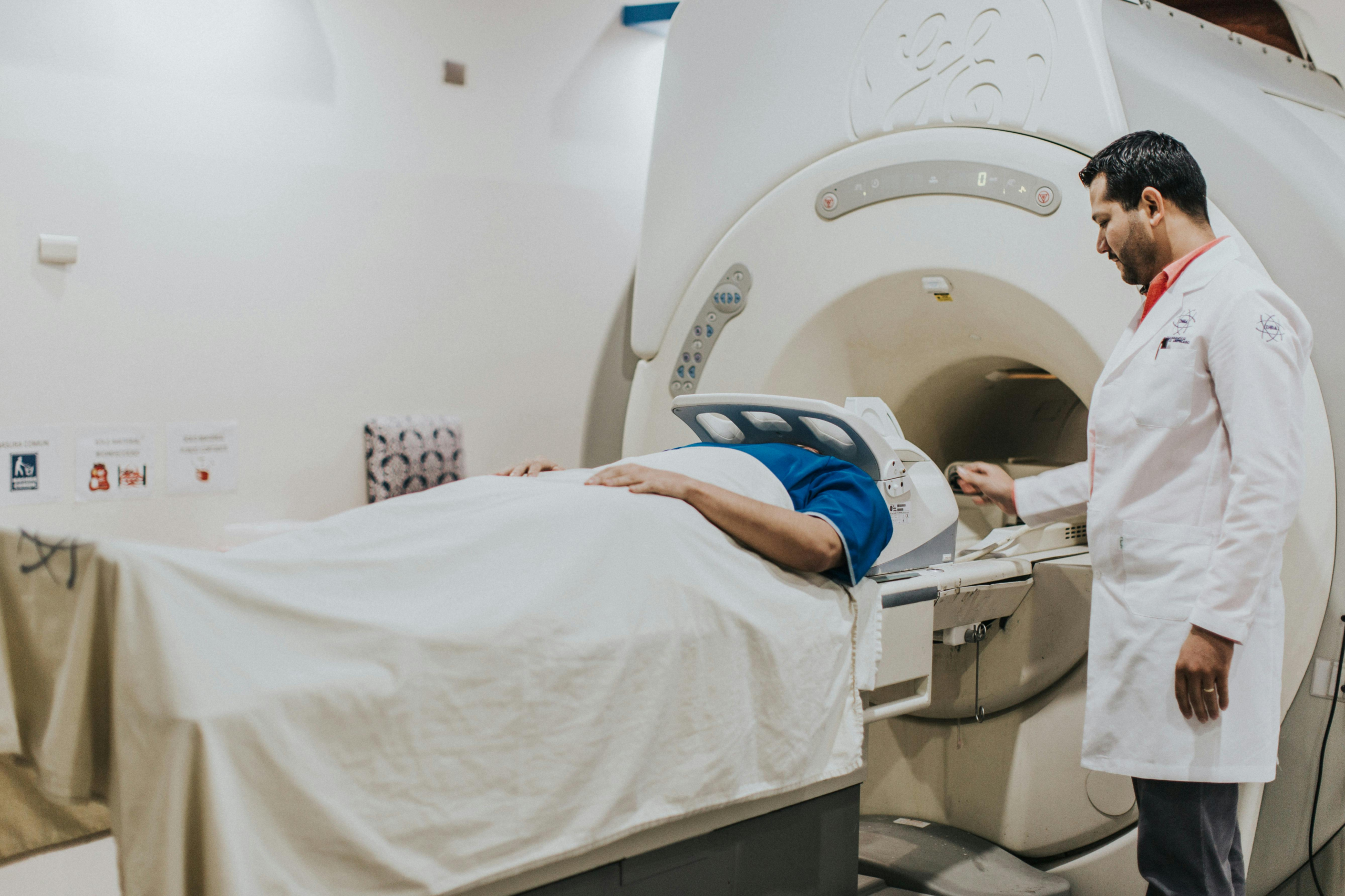 MRI tech performs scan on man