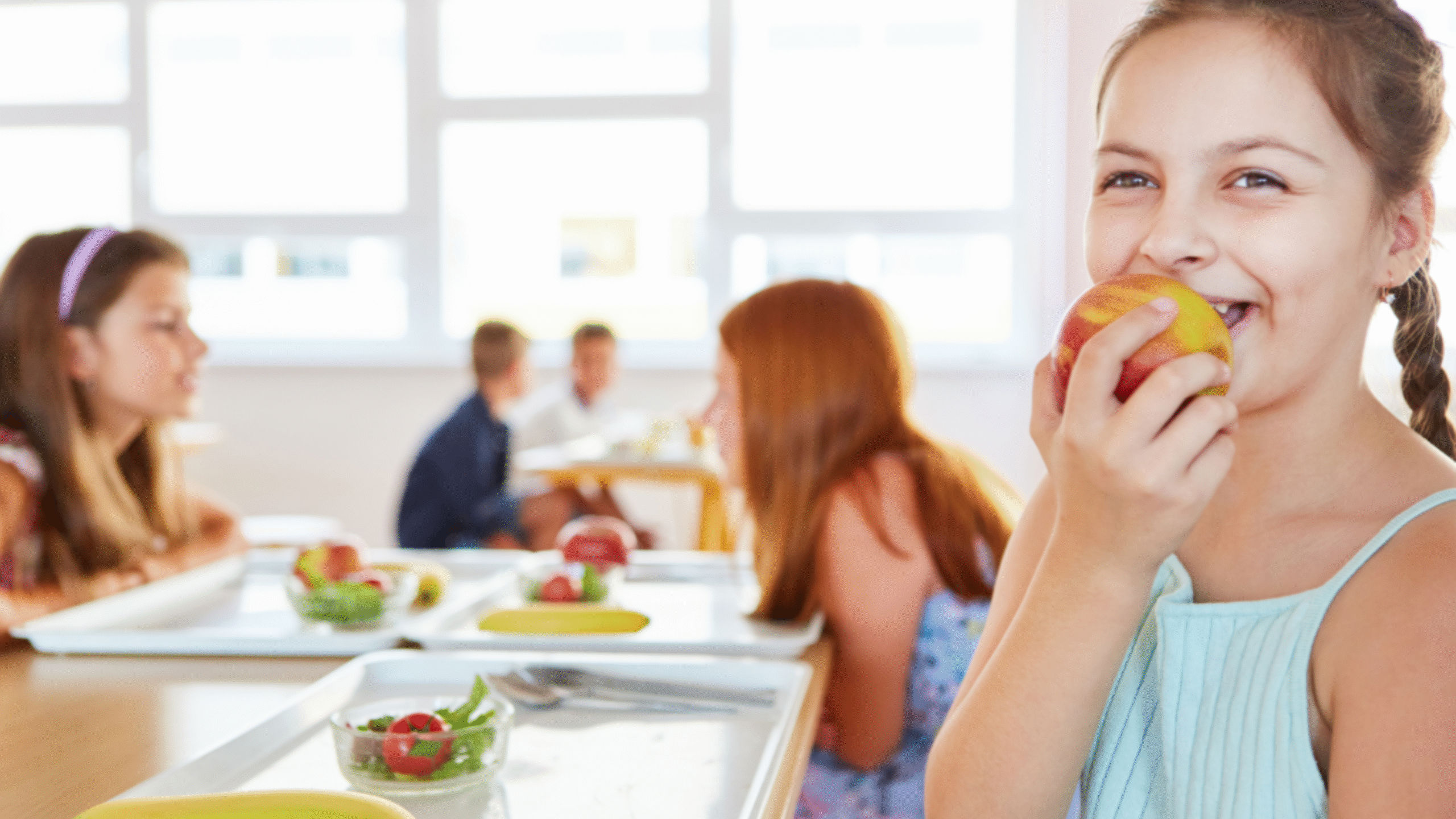 child eating an apple