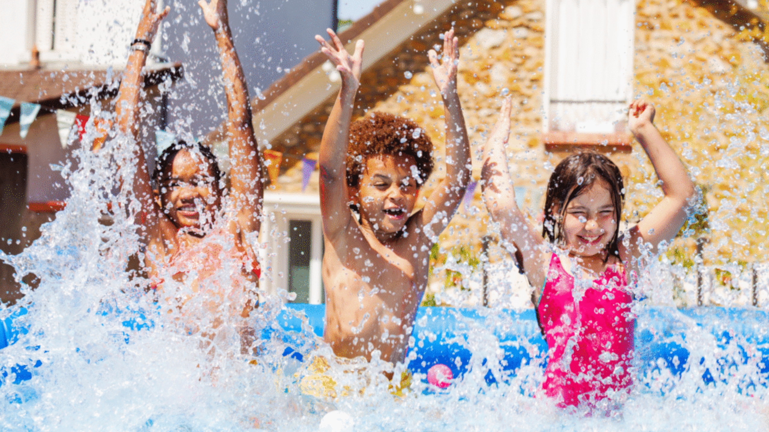 Kids jumping in the pool