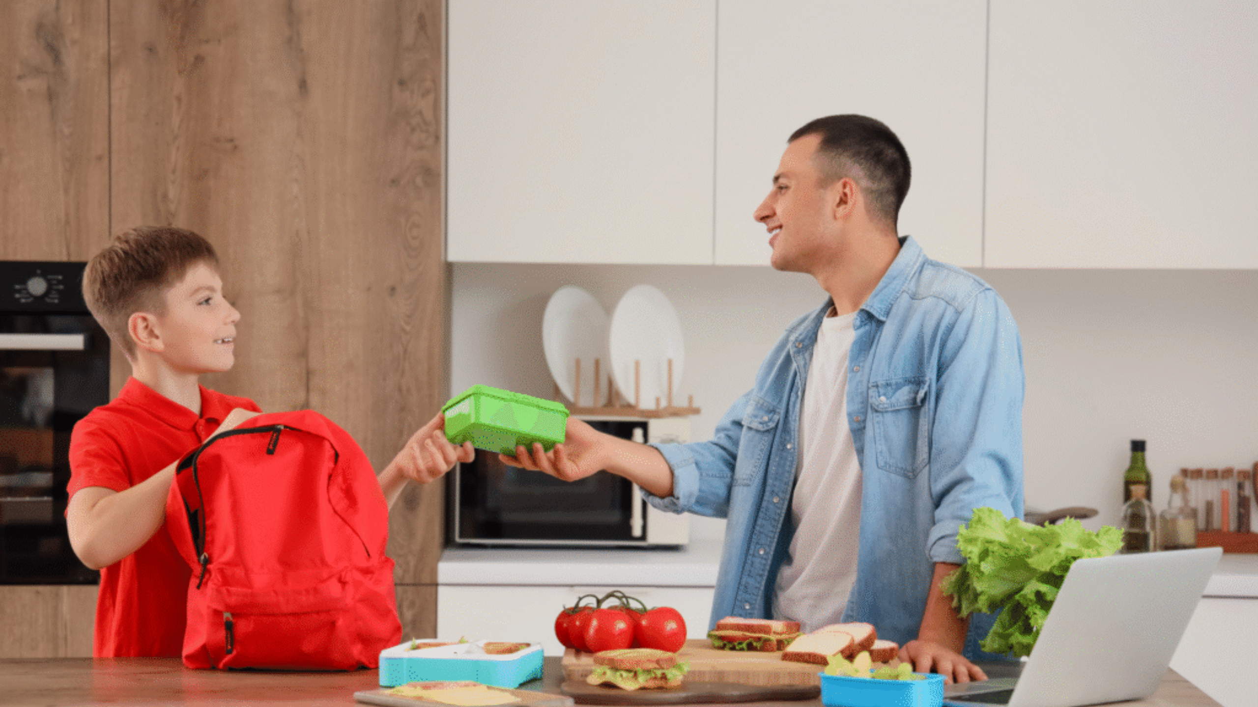 man fixes his son's healthy lunch
