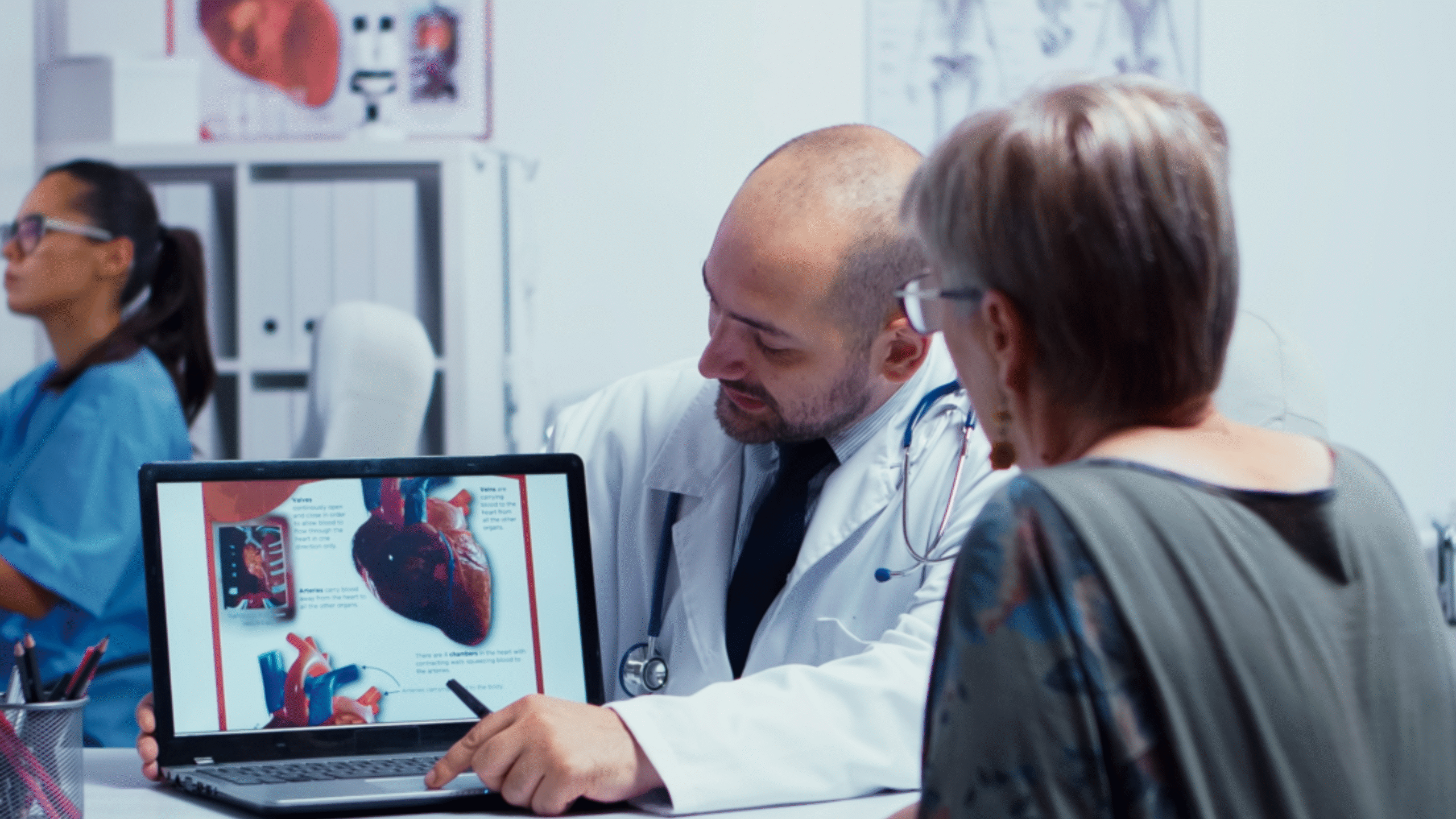 Doctor reviews cardiology results with female patient
