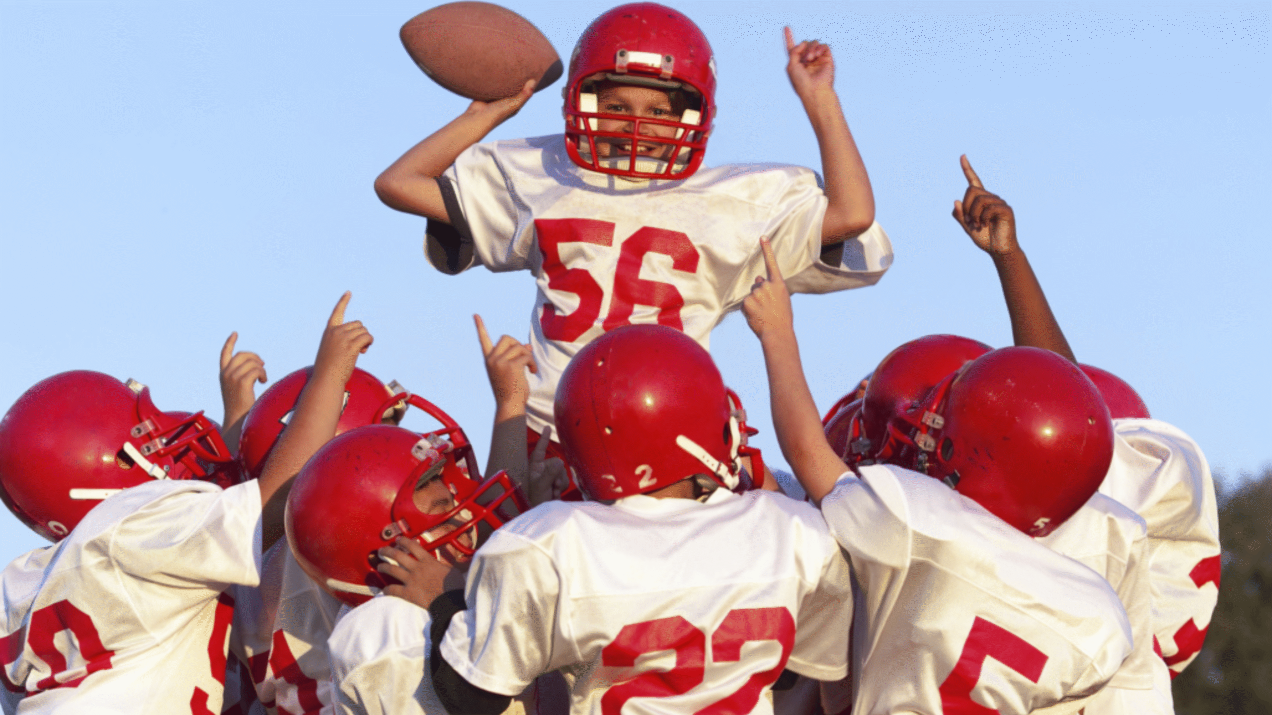 youth football team celebrates win