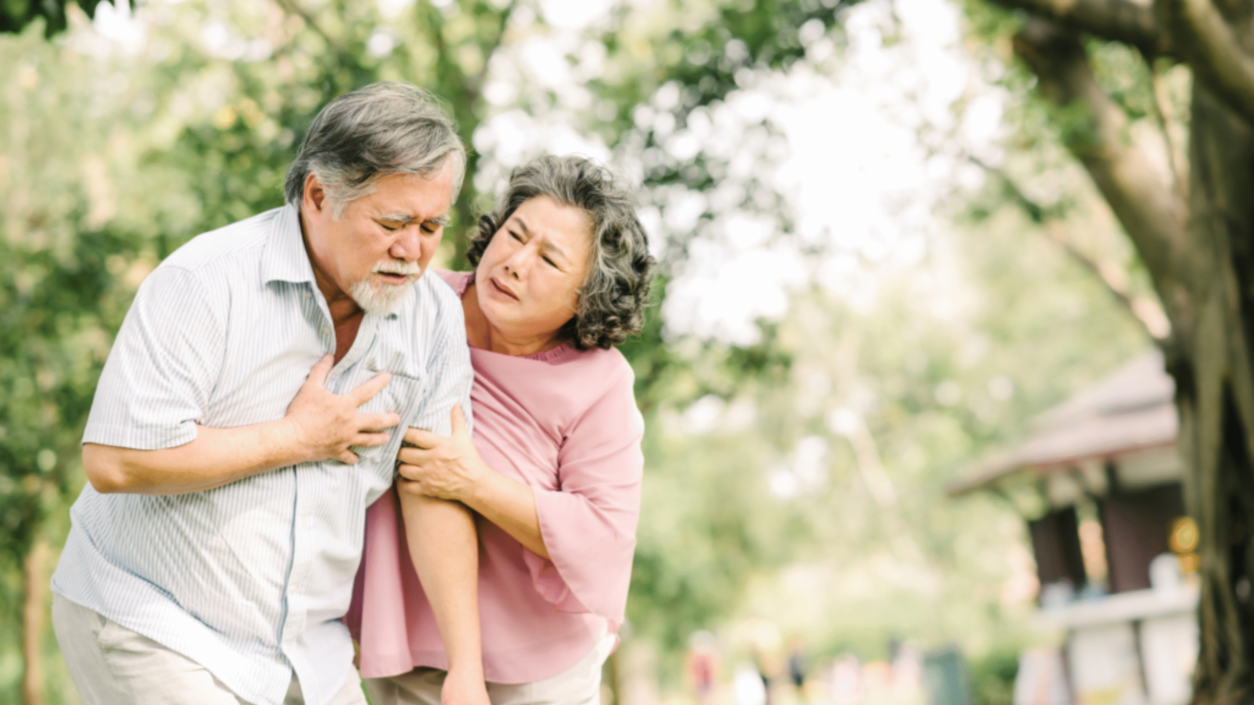 wife helps husband that is experiencing chest pains